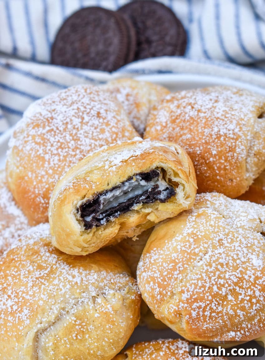 a pile of easy air fried oreos on a white serving plate