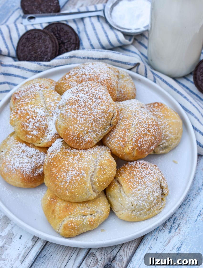 a pile of easy air fried oreos on a white serving plate