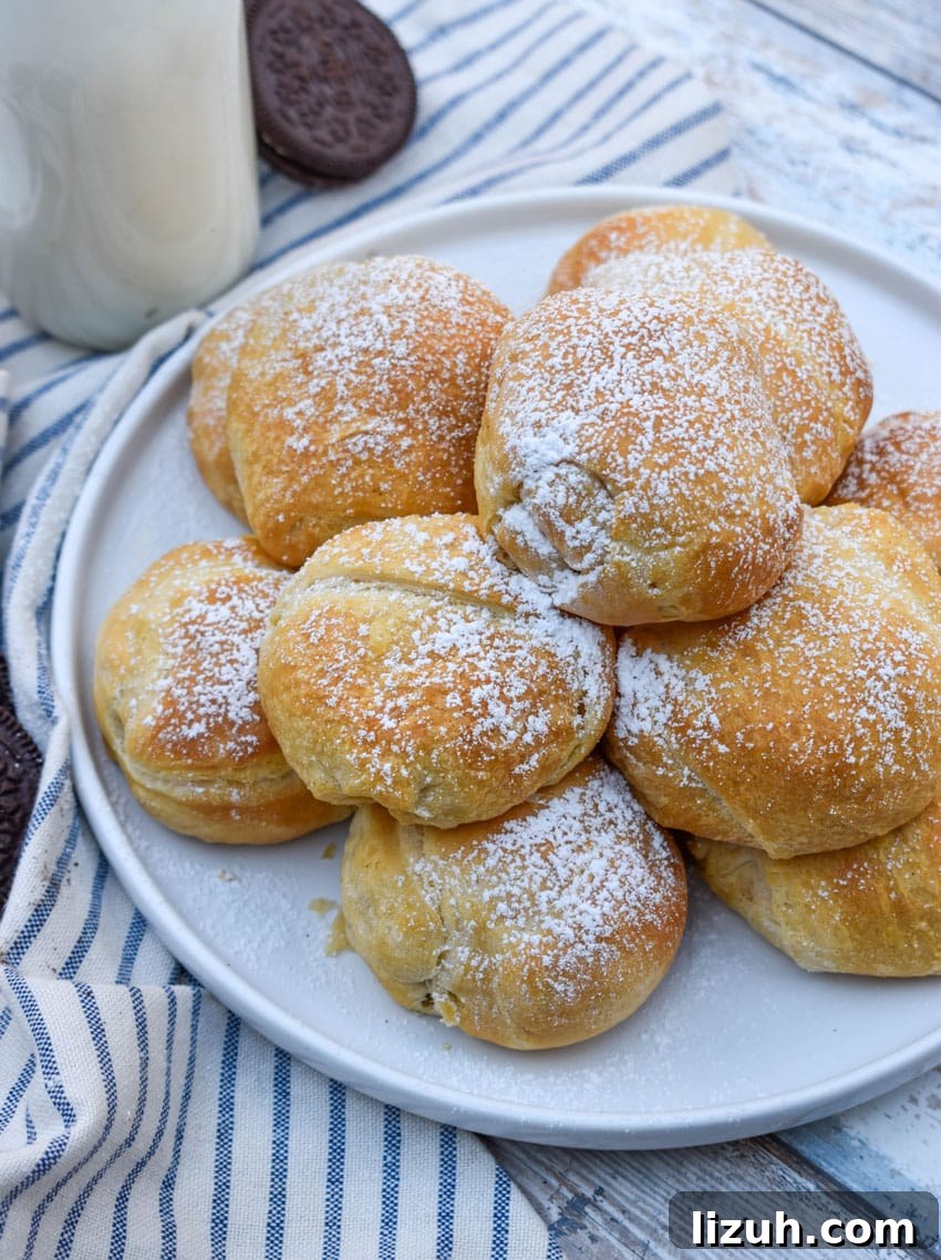 a pile of easy air fried oreos on a white serving plate