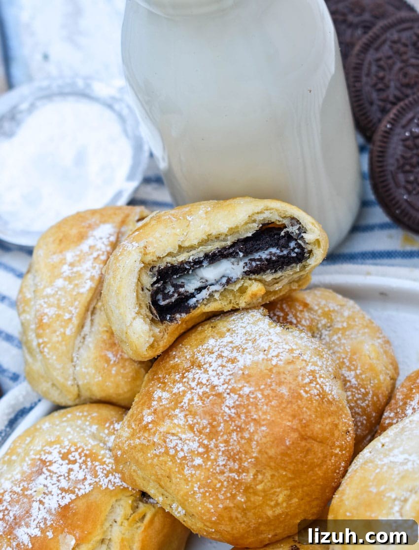 a pile of easy air fried oreos on a white serving plate