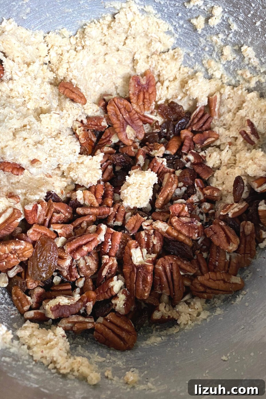 Pecan and Raisin Oatmeal Cookies, adding pecans and raisins to batter