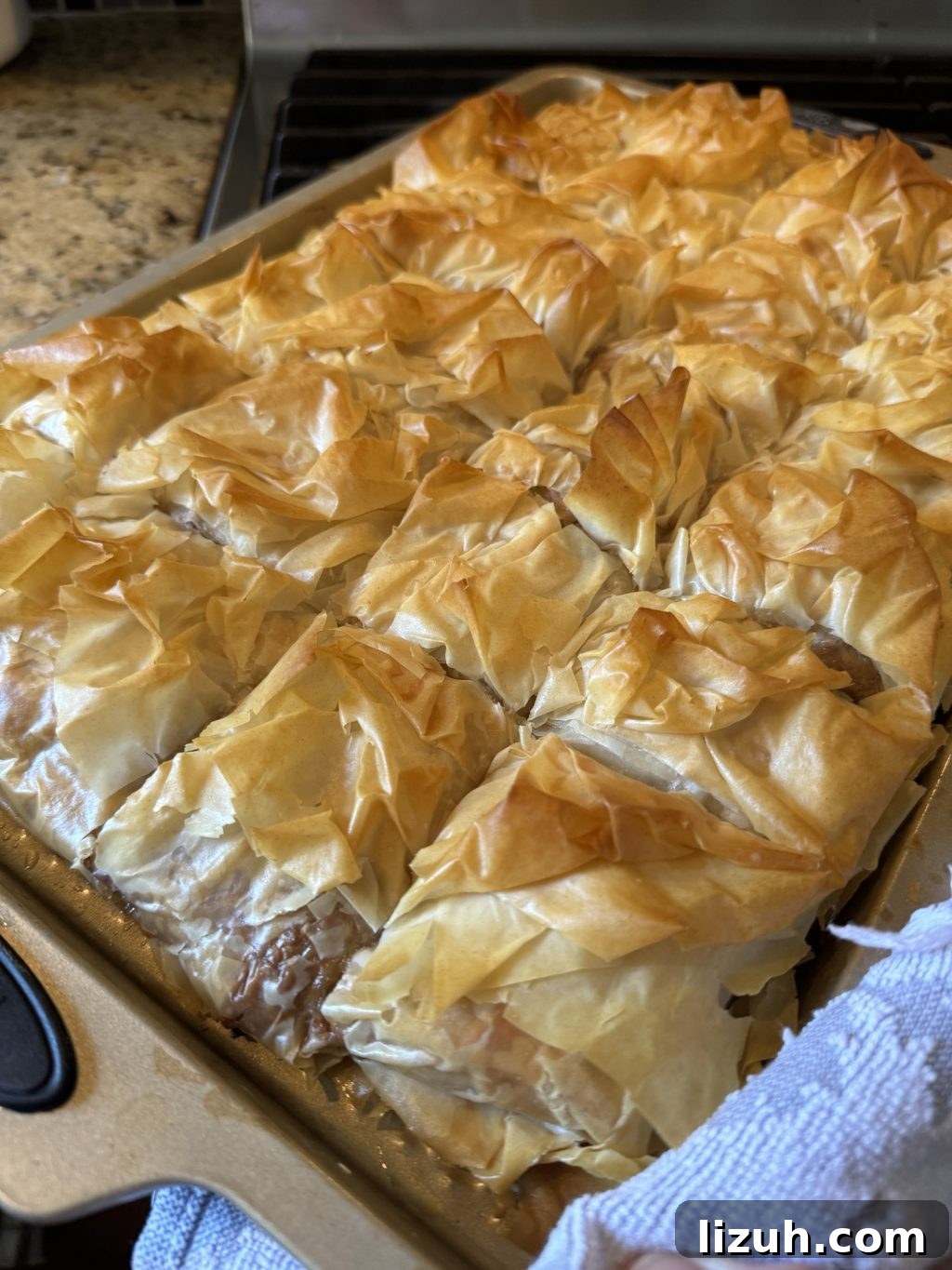 The finished Cheeseburger Spring Roll dish, cut into squares on a baking dish