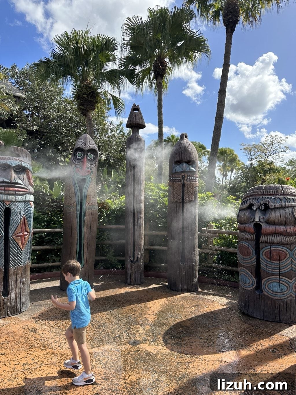Tiki statures spraying mist