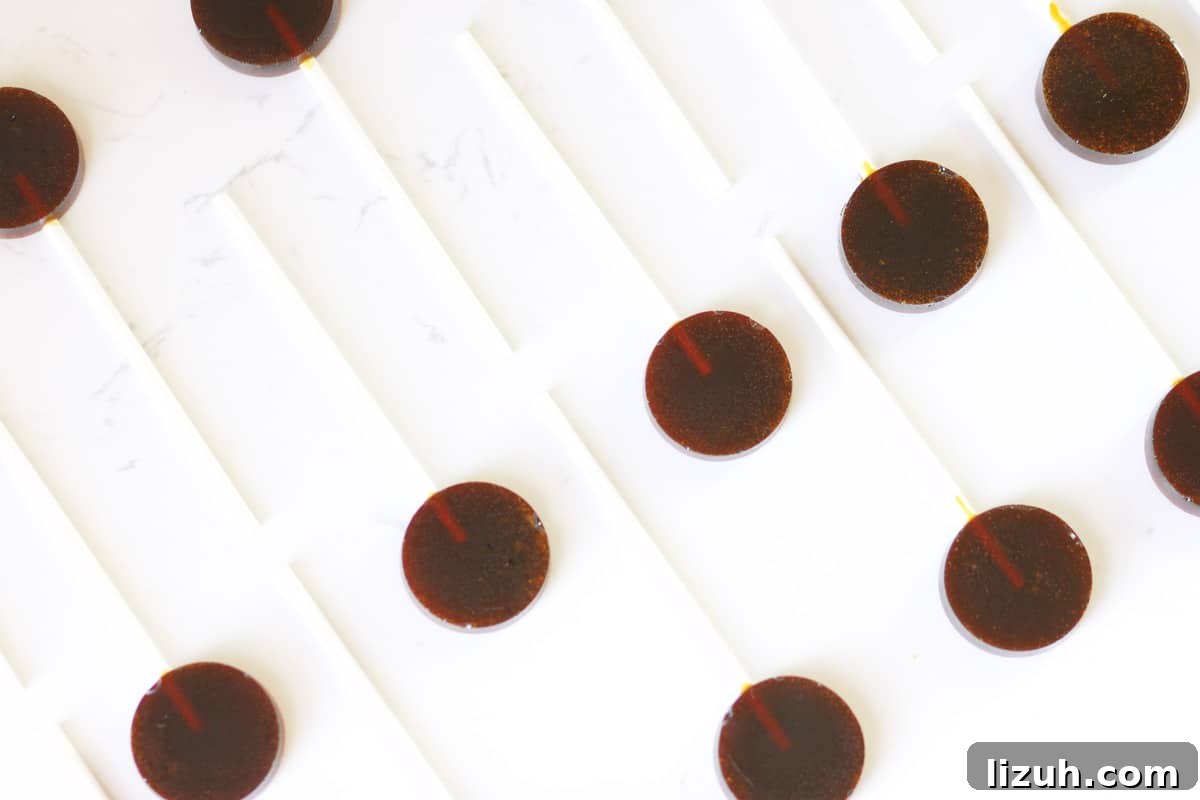 Homemade Honey Lollipops: A Sugar-Free Recipe You’ll Love 4 honey lollipops laid out on a counter