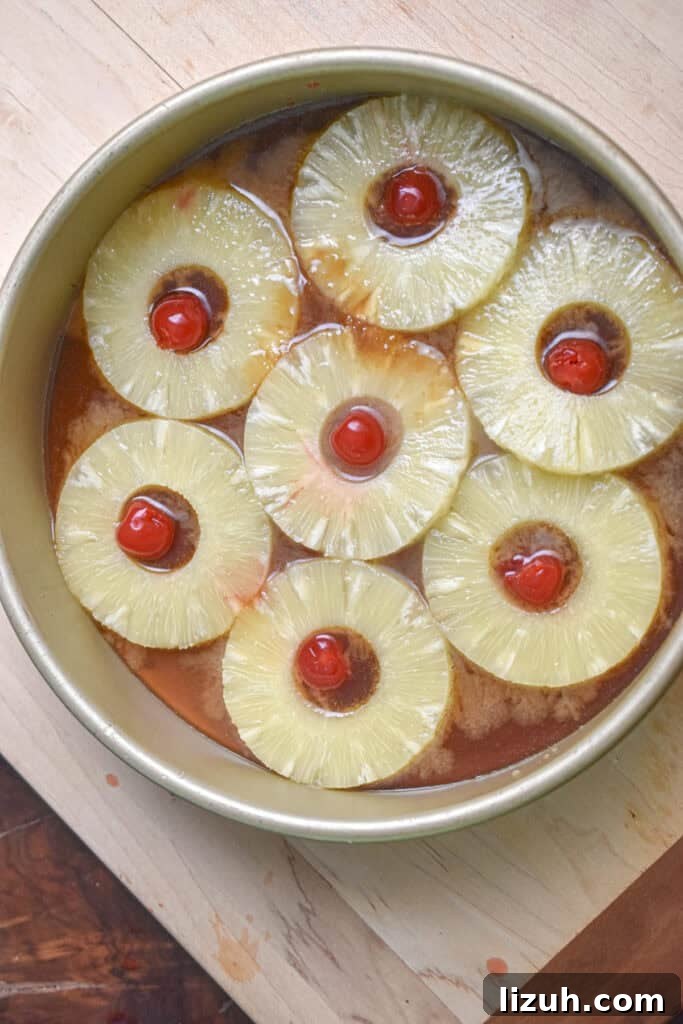 Sourdough Pineapple Upside-Down Cake Recipe for Moist, Tangy Loaf 5 The pineapple rings and cherries are in the caramel.