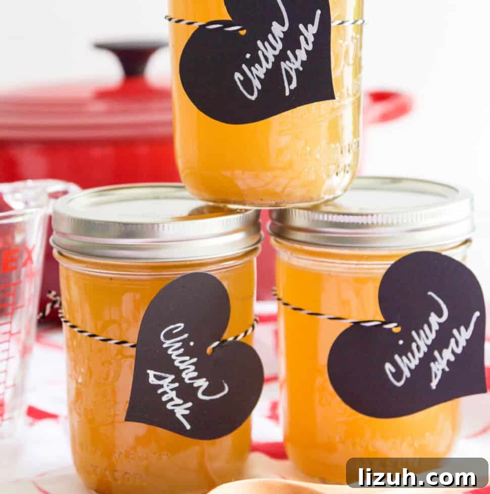 Homemade Chicken Bone Broth Recipe: Rich, Slow-Simmered Stock 17 3 small Mason jars filled with chicken stock and black heart shaped labels.