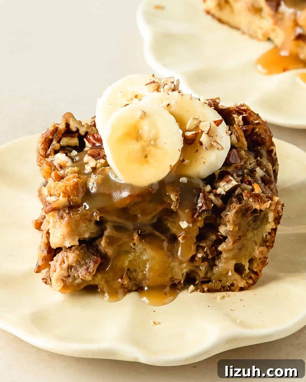 Decadent Banana Bread Pudding Recipe with Caramel Sauce 2 Banana bread pudding is a decadent breakfast or dessert dish made with day old bread soaked in a rich cinnamon banana custard, topped with crunchy pecans. Once baked this bread and banana pudding is topped with salty sweet brown sugar caramel sauce and sliced bananas.