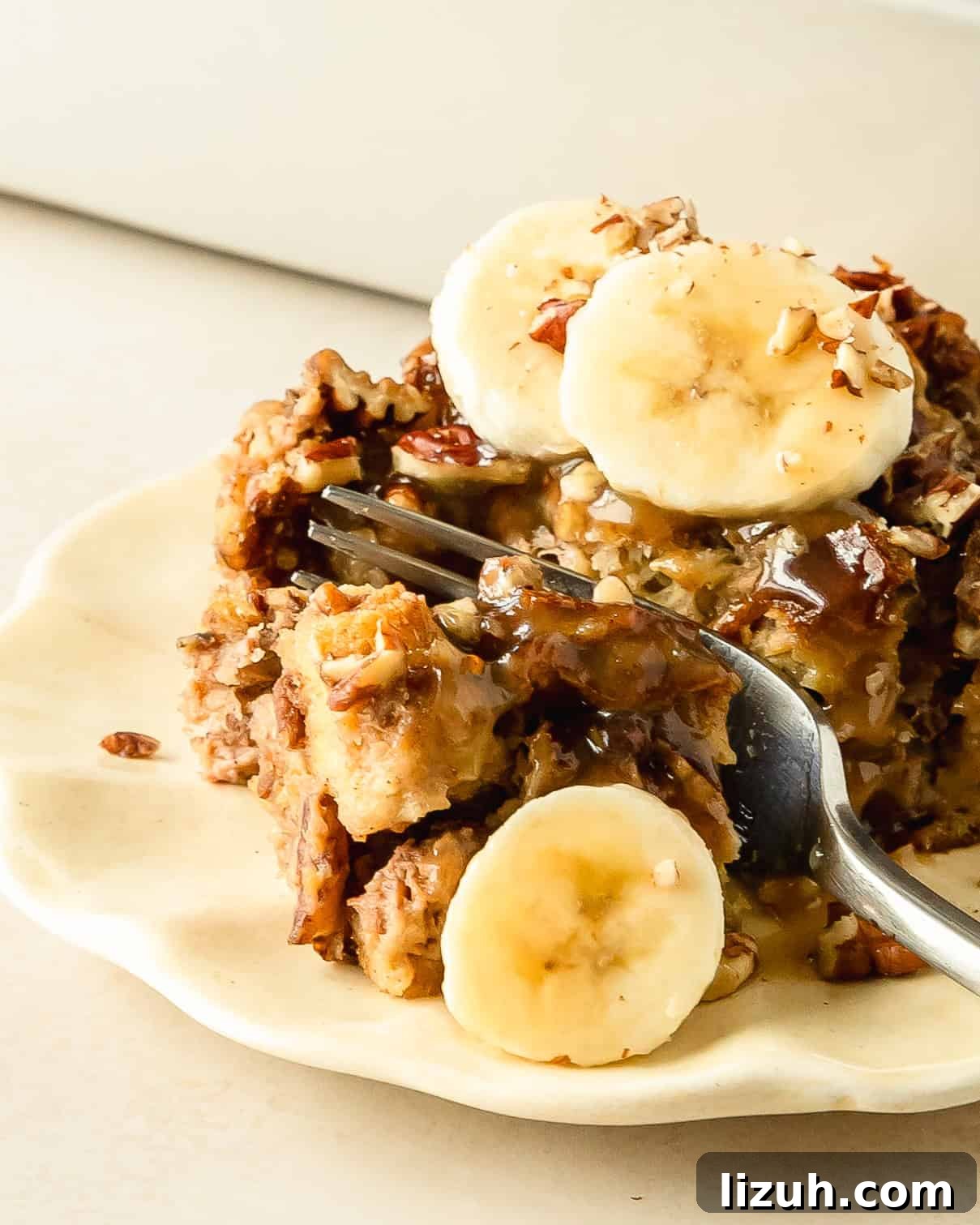 Decadent Banana Bread Pudding Recipe with Caramel Sauce 9 Banana bread pudding is a decadent breakfast or dessert dish made with day old bread soaked in a rich cinnamon banana custard, topped with crunchy pecans. Once baked this bread and banana pudding is topped with salty sweet brown sugar caramel sauce and sliced bananas.