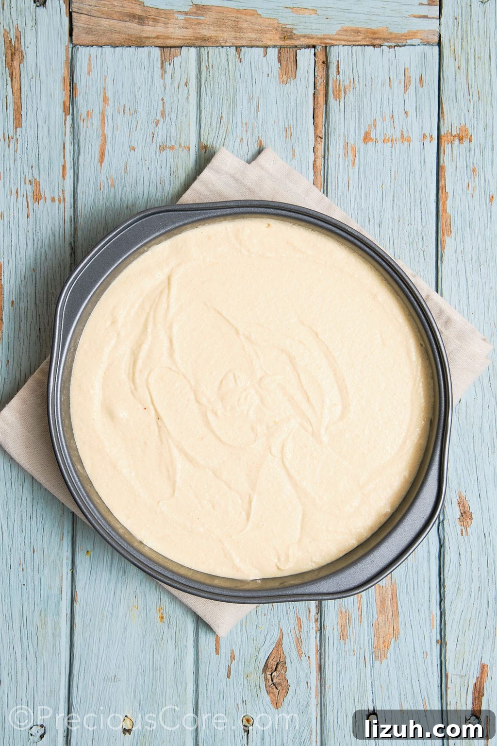 cake batter for the almond and pear cake in a cake pan.