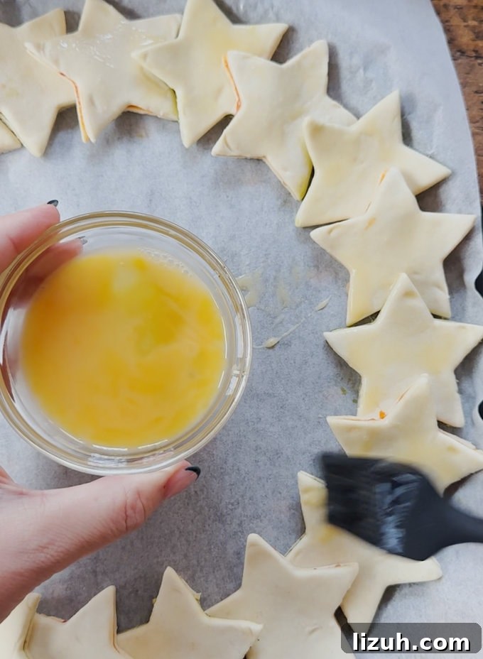Star wreath being egg washed ready for the oven.