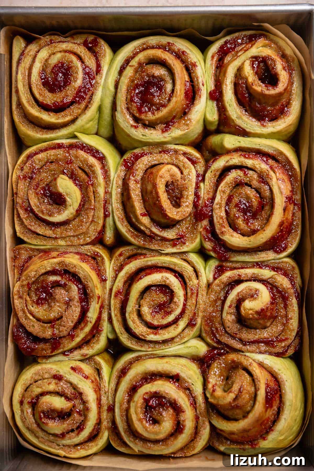 Baked cinnamon rolls in a pan.