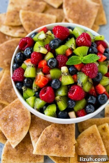 Authentic Chipotle Salsa Recipe for Smoky, Flavorful Dips 7 A bowl of fruit salsa served with cinnamon sugar chips.