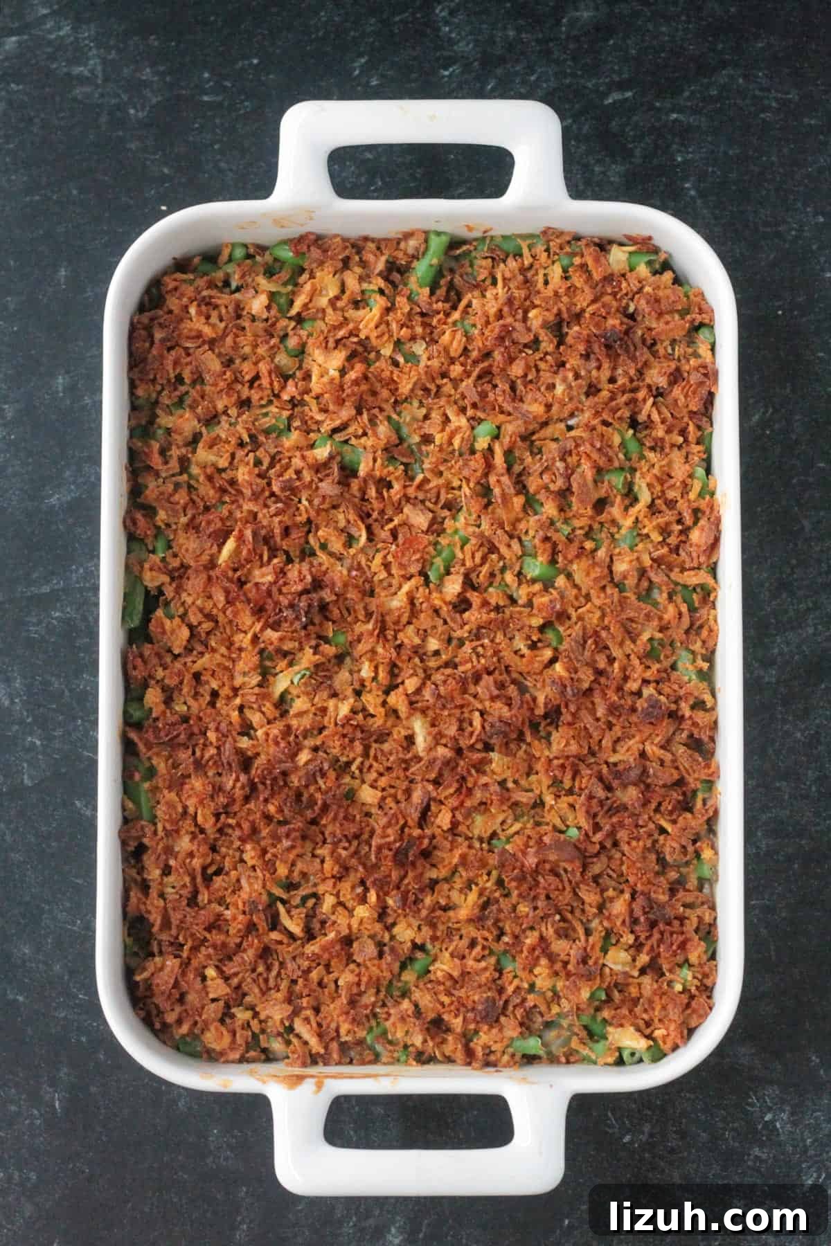 Baked casserole with browned crunchy onion topping.