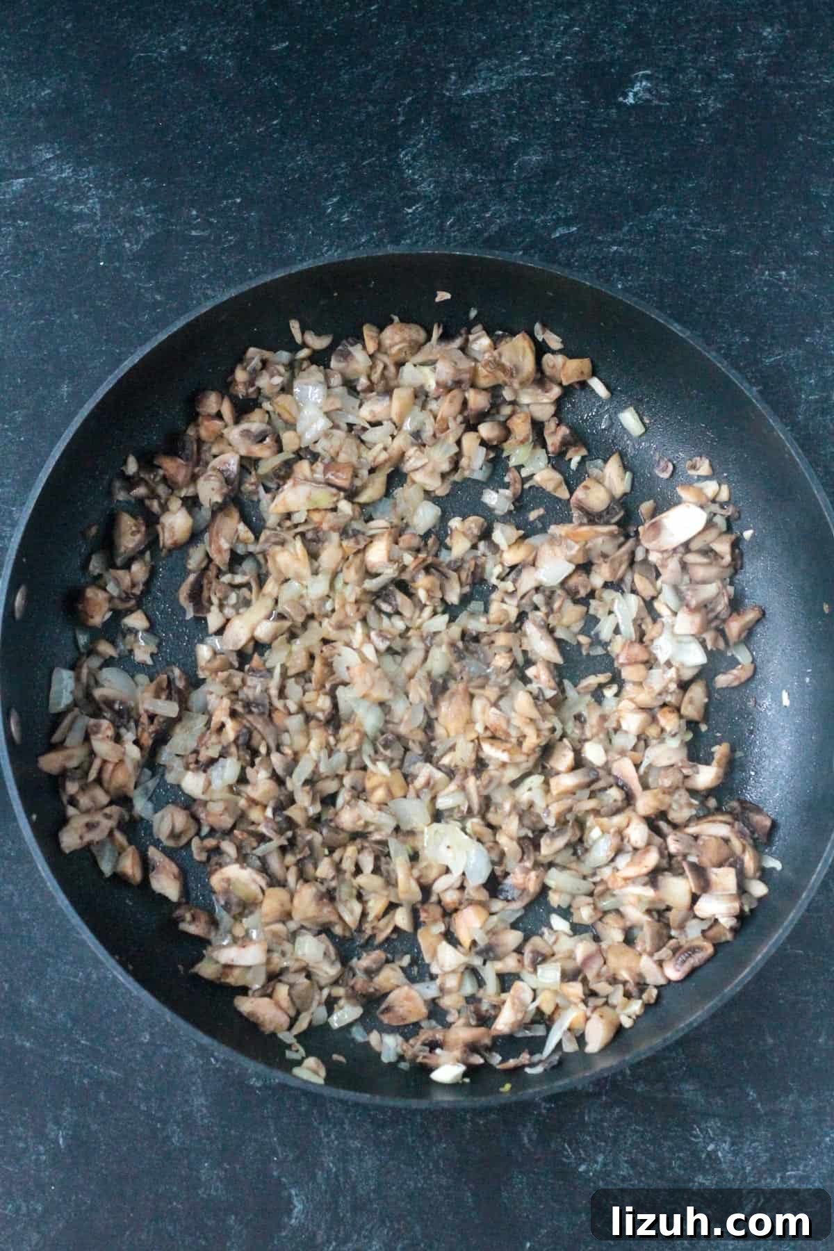 Cooked mushrooms in a skillet.