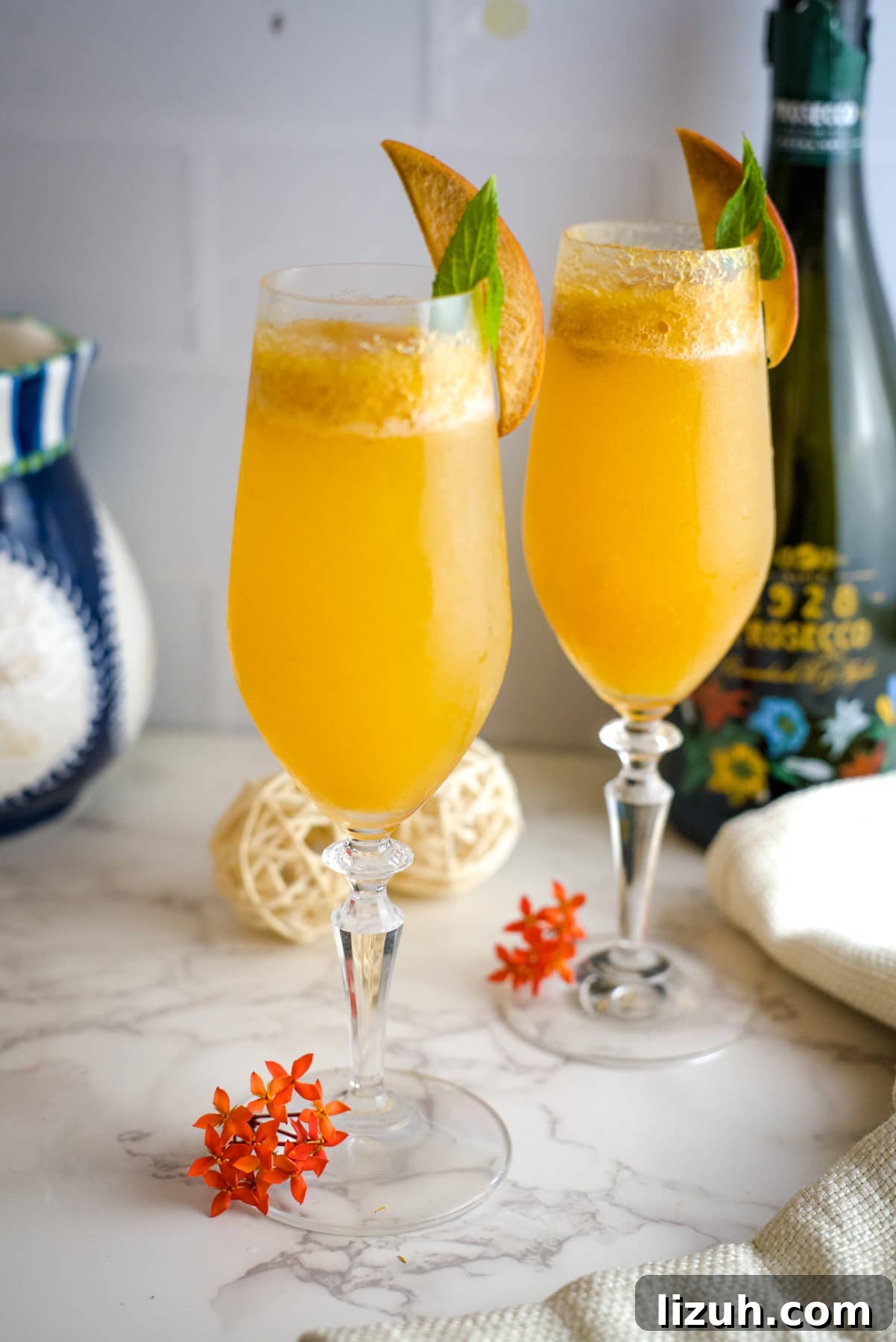 two glasses of peach bellinis