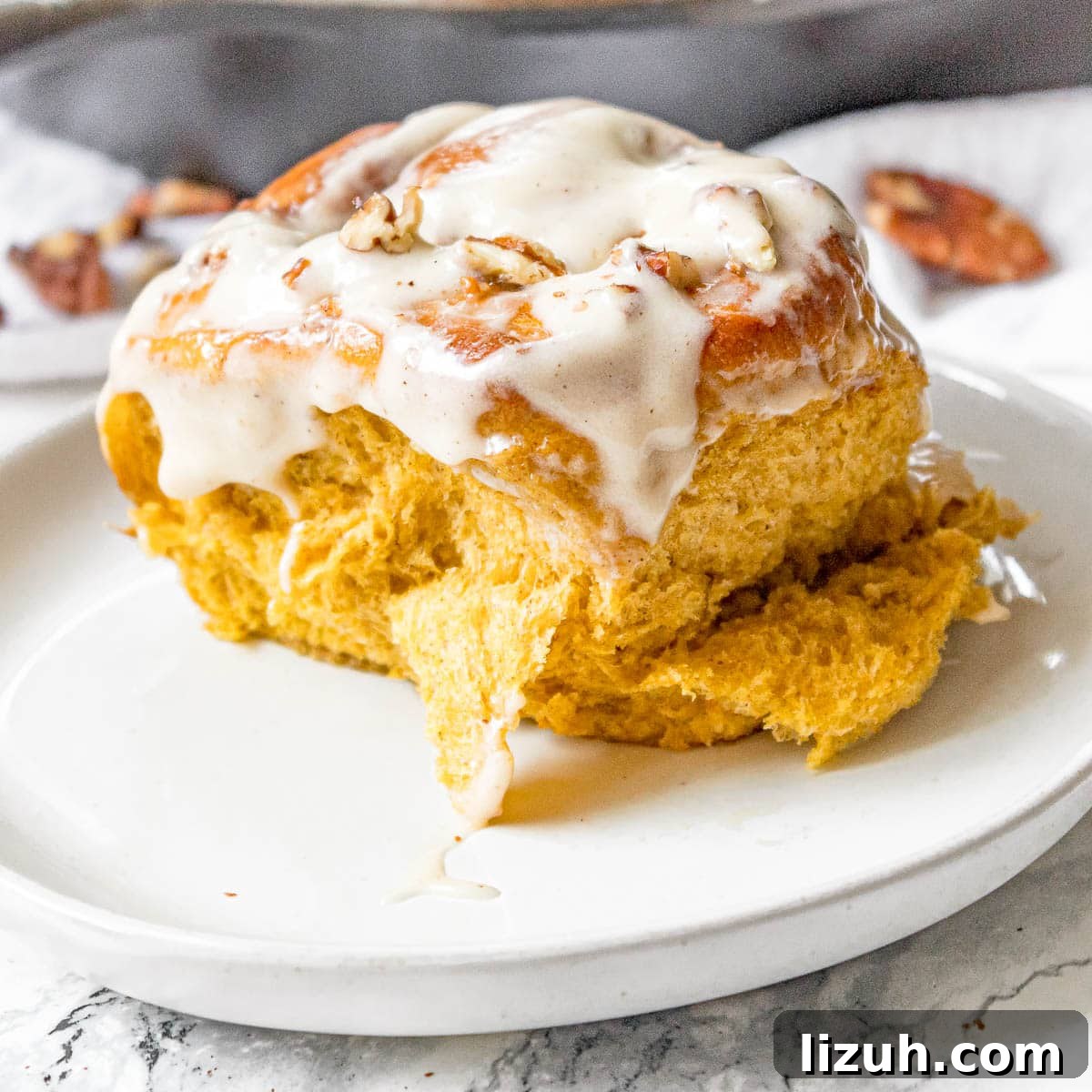 Pumpkin Spice Cinnamon Rolls with Maple Glaze 7 pumpkin orange cinnamon rolls