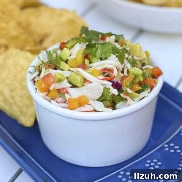 Crab ceviche in a bowl with tortilla chips.