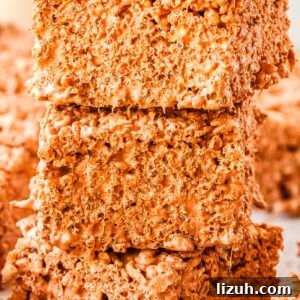 Thick Chewy Chocolate Rice Krispies Treats Recipe 8 Three Chocolate Rice Krispies Treats stacked on each other.