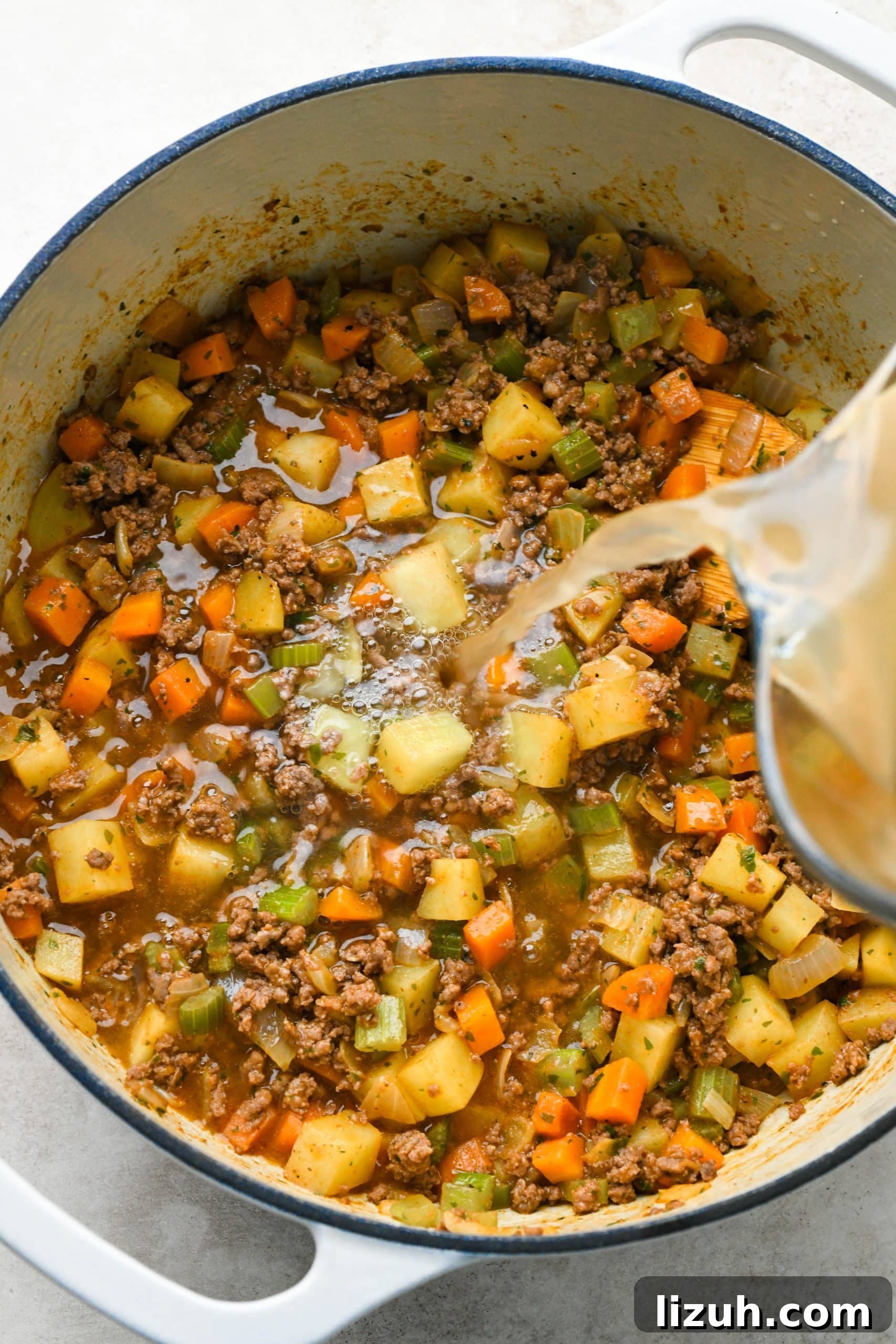 Dairy-Free Cashew Cream Shepherd’s Pie Soup Recipe 11 How to make shepherds pie soup: Pouring broth into the soup pot.