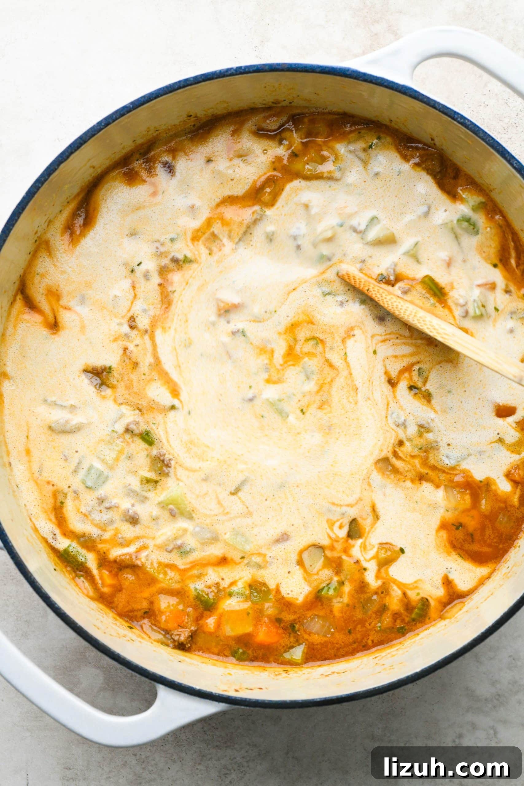 Dairy-Free Cashew Cream Shepherd’s Pie Soup Recipe 14 How to make shepherds pie soup: Stirring soup together with cashew cream.