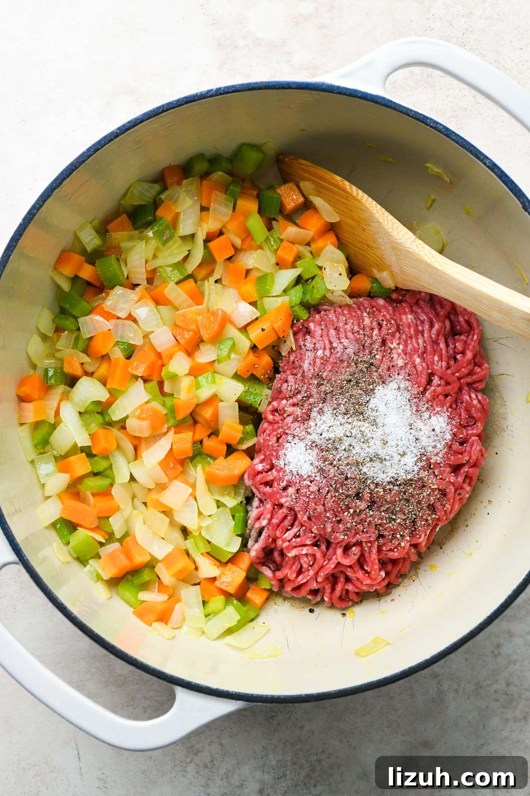 Dairy-Free Cashew Cream Shepherd’s Pie Soup Recipe 7 How to make shepherds pie soup: Adding ground beef with salt and pepper to the soup pot.