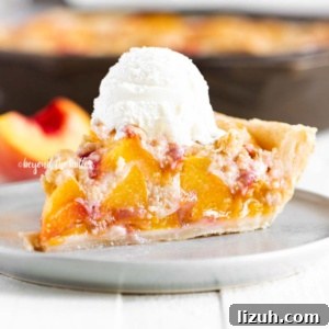 Brown Sugar Peach Crumble Pie Recipe — Rustic Summer Dessert 11 Slice of brown sugar peach crumble pie on dessert table with rest of pie in background.