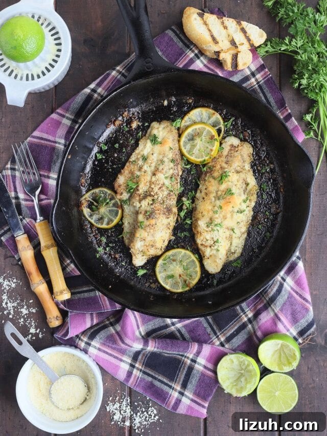 Back-to-School Dinner Ideas: Quick Family-Friendly Recipes 26 Two catfish fillets garnished with slices of lime in a cast iron skillet.