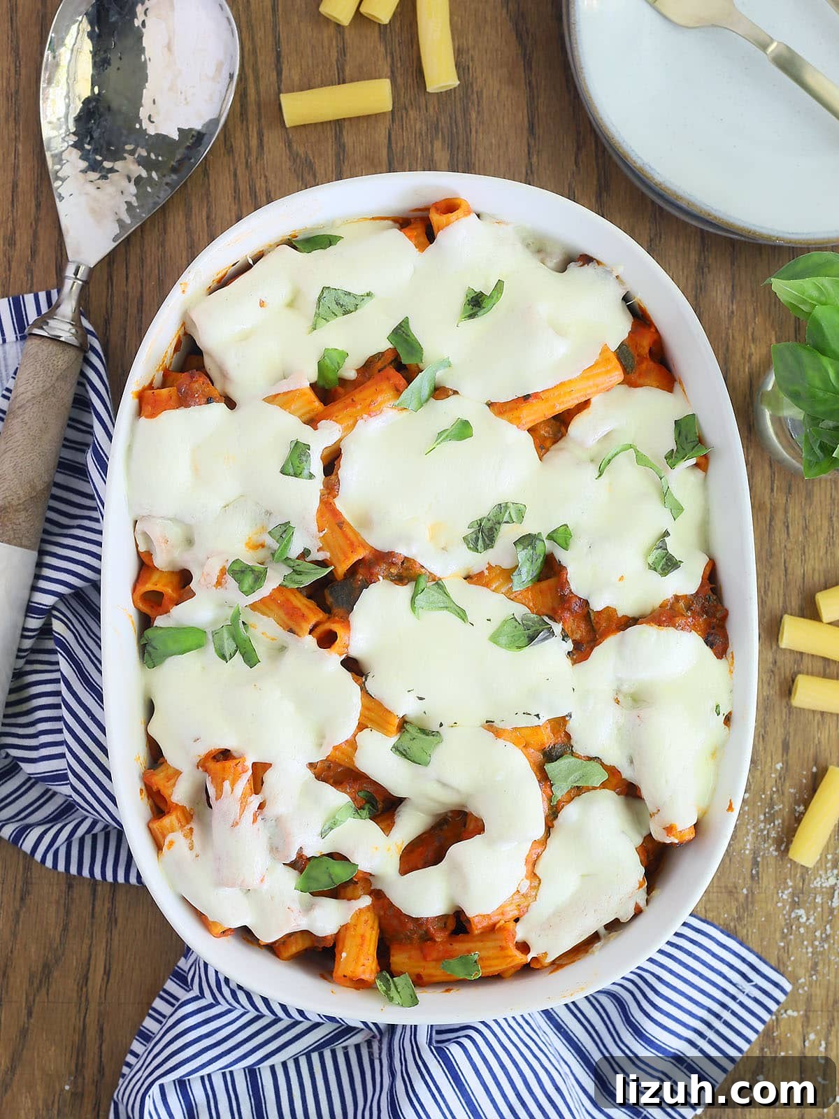 Back-to-School Dinner Ideas: Quick Family-Friendly Recipes 28 spicy rigatoni casserole in a white oval casserole dish