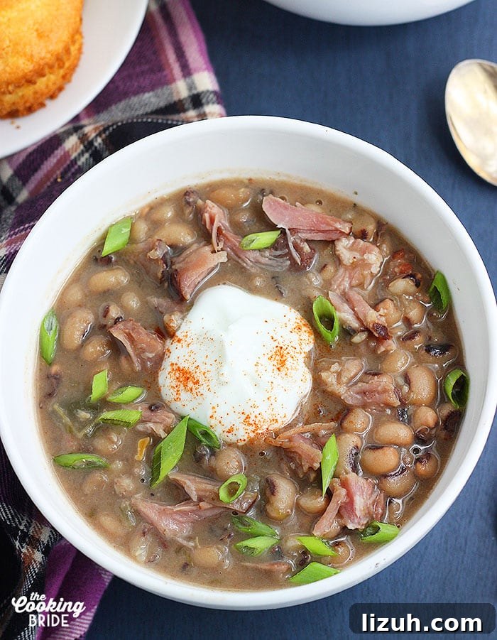 Back-to-School Dinner Ideas: Quick Family-Friendly Recipes 39 bowl of black eyed pea soup with a dollop of soup cream, sprinkle of cayenne pepper and sliced green onions