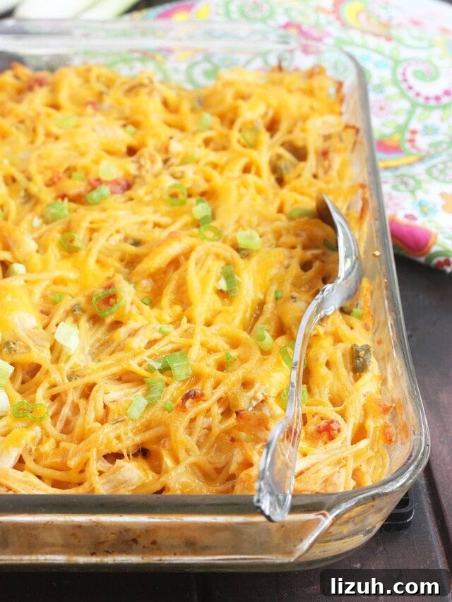 Back-to-School Dinner Ideas: Quick Family-Friendly Recipes 46 clear pyrex dish of baked chicken spaghetti with a metal serving spoon