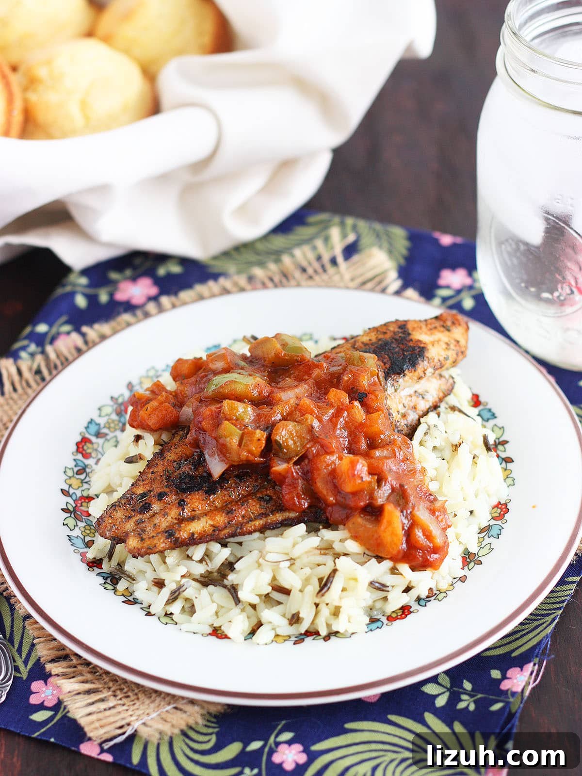 Back-to-School Dinner Ideas: Quick Family-Friendly Recipes 8 Blackened catfish fillet topped with Creole tomato sauce on a bed of rice.