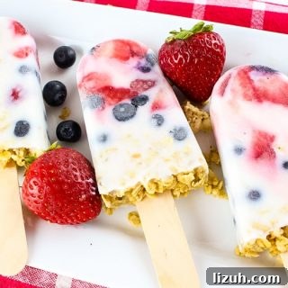 These easy yogurt popsicles are packed with fresh berries and granola, making them a tasty frozen breakfast to enjoy on-the-go on busy mornings.