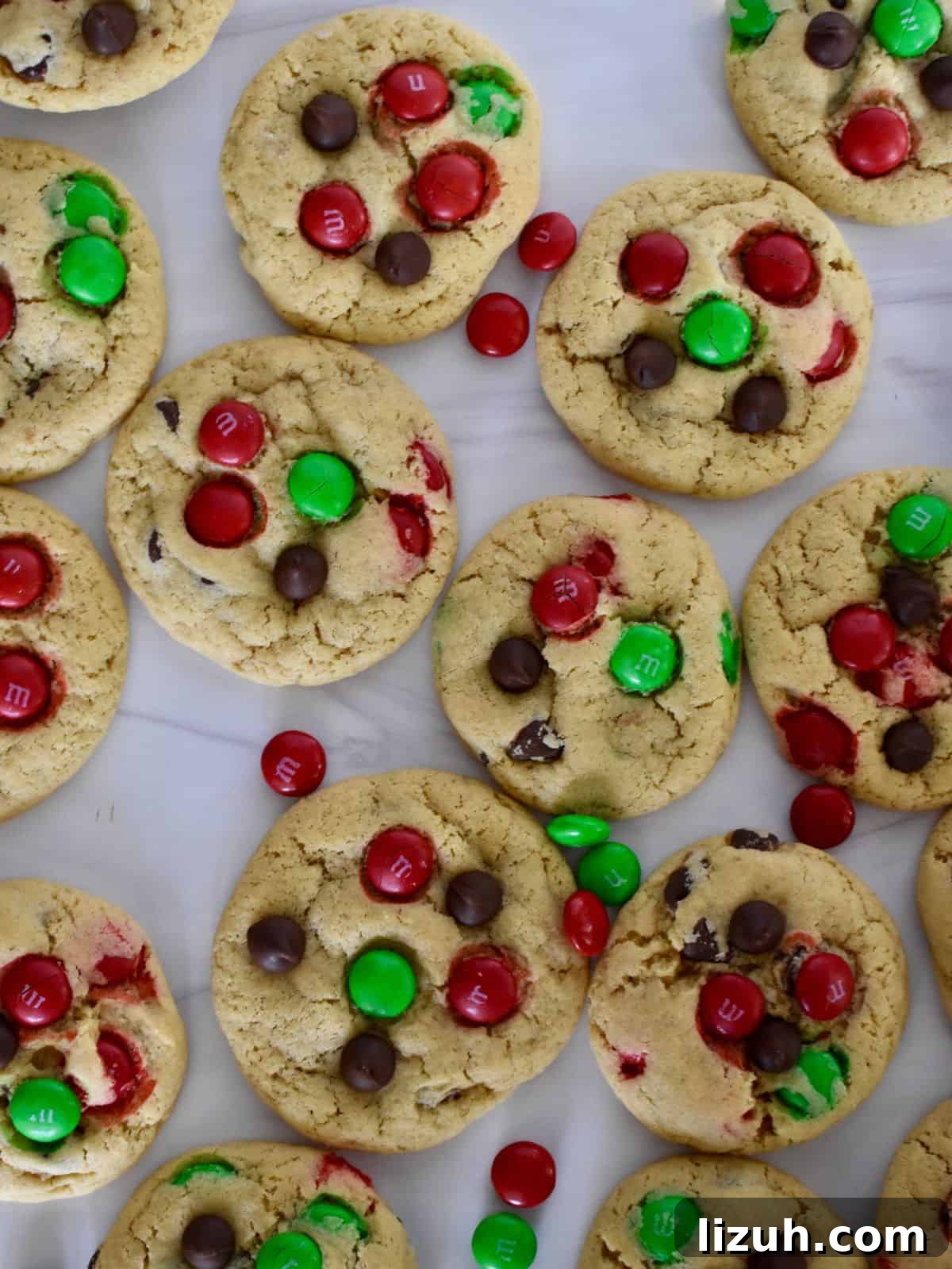 Christmas M&M Cookies Recipe: Festive, Chewy Holiday Cookies 3 overhead photo of Christmas M&M Cookies on a white surface.