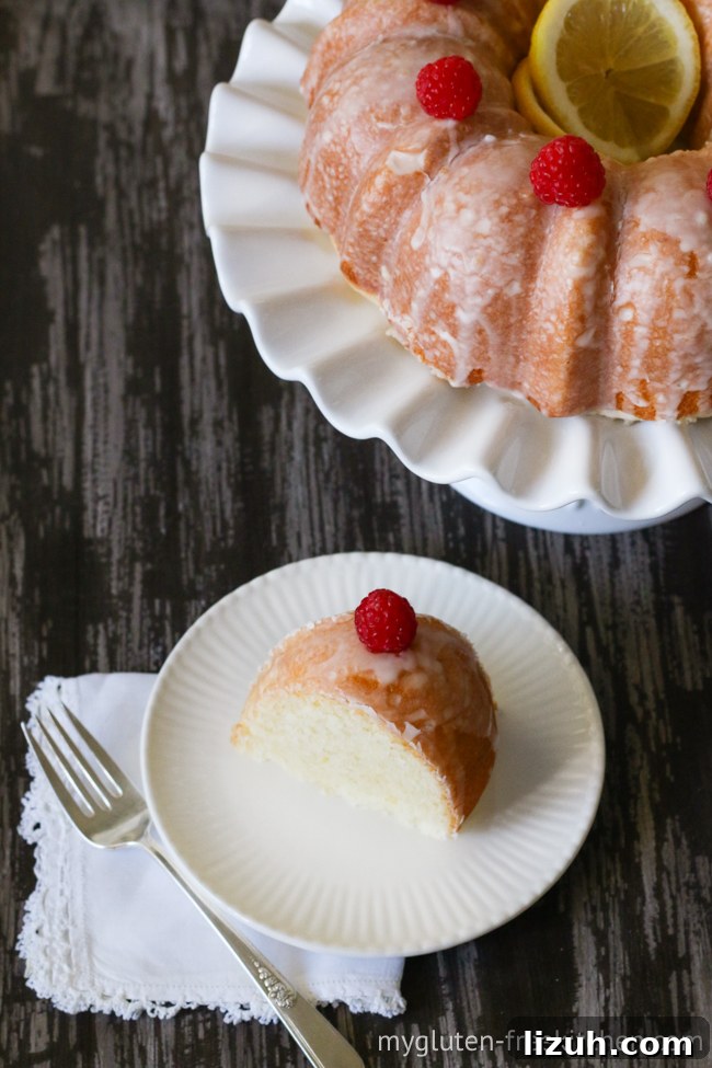 Gluten-Free Lemon Coconut Cake (Dairy-Free Recipe) 4 gluten-free dairy-free lemon coconut cake with a cut slice on a plate with a fork