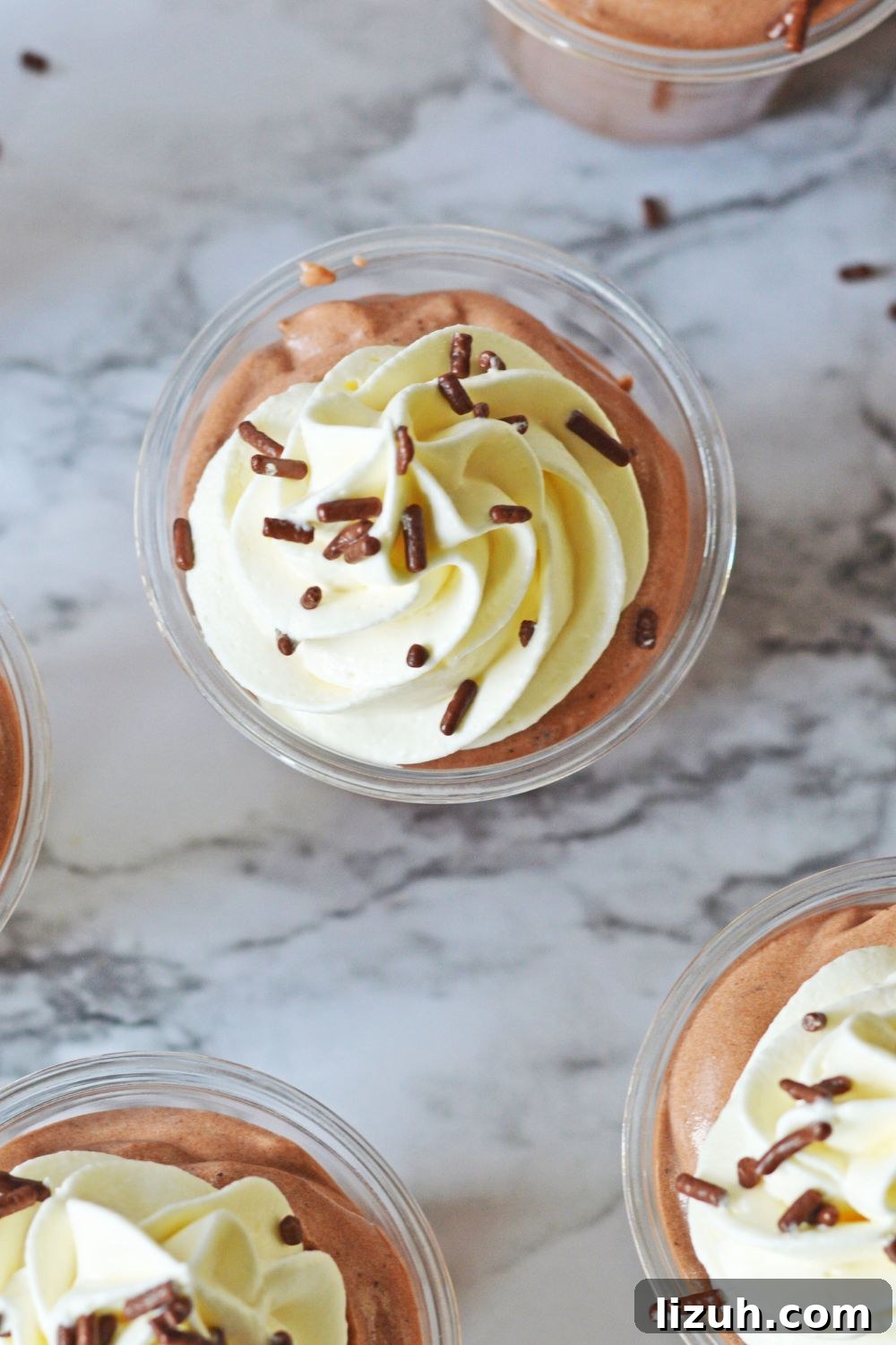 overhead look of Rumchata Pudding Shots on a marble table 