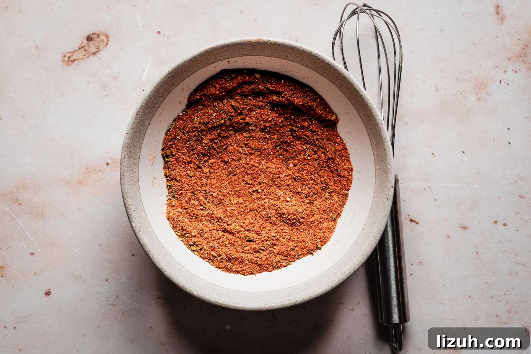 Homemade Blackened Seasoning Mix for Bold, Flavorful Dishes 6 Blackened Seasoning spices whisked together in a bowl.