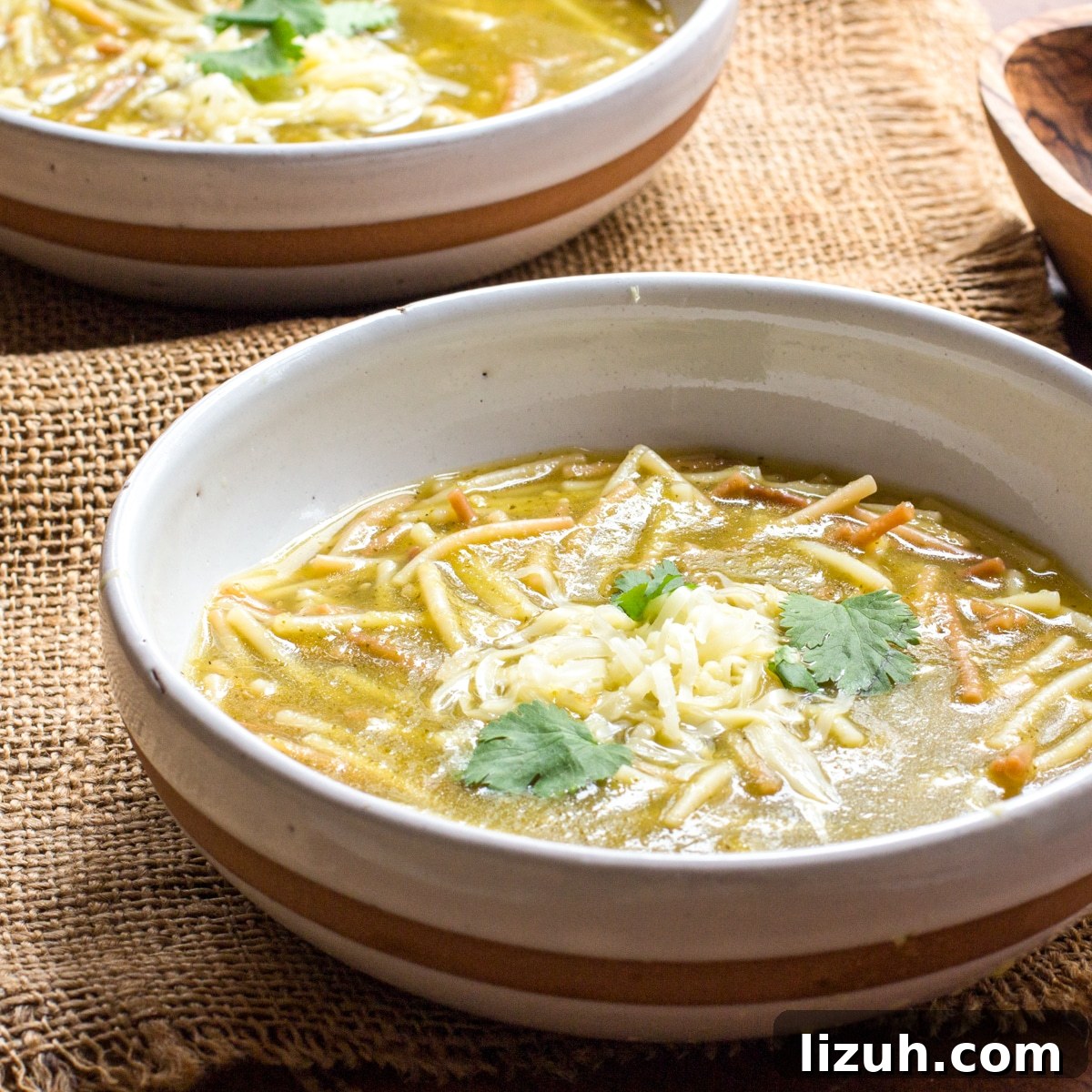 April Vegetarian Meal Plan: Week 4 Recipes & Grocery List 3 Two bowls of Mexican spaghetti soup on a piece of burlap.