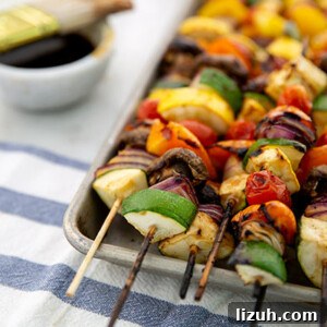 Grilled Vegetable Skewers: Flavorful Gluten-Free Summer Recipe 3 Closeup of Grilled Veggie Skewers with dipping sauce in the background