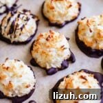 Chewy Coconut Macaroons: Gluten-Free Coconut Cookie Recipe 11 Gluten-free coconut macaroons drizzled and dipped in chocolate on a sheet pan.