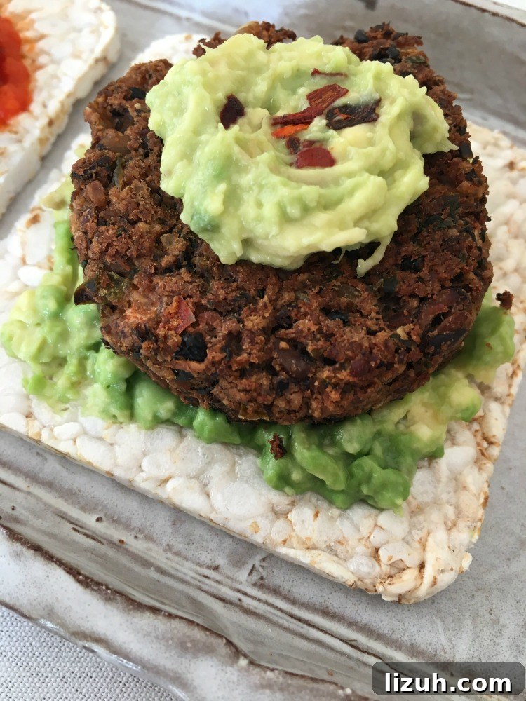 Black Bean Veggie Burger Recipe — Flavorful Homemade Patties 12 Mini black bean veggie burger on a rice cake, topped with guacamole.