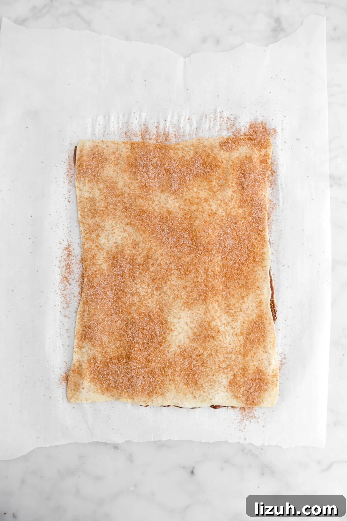 sheet of puff pastry dusted with cinnamon sugar.