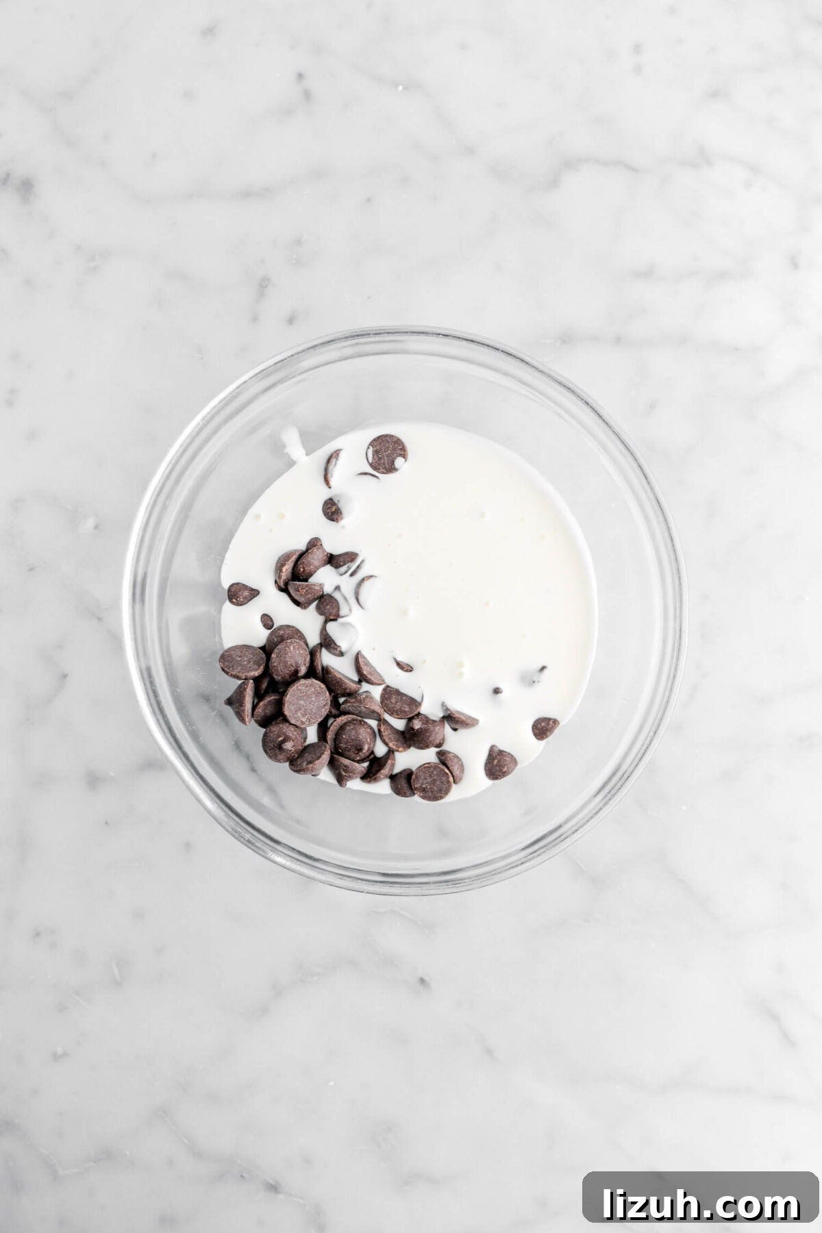 chocolate chips and cream in glass bowl.