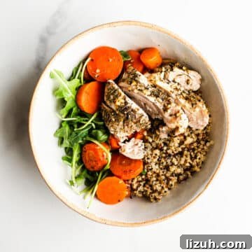 Roasted Carrot and Chicken Quinoa Bowl with Lemon-Tahini Drizzle 13 Chicken and quinoa in a bowl.
