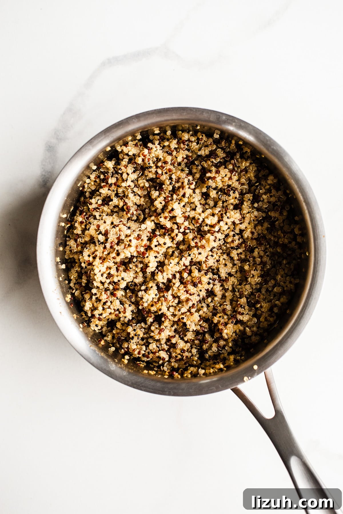 Roasted Carrot and Chicken Quinoa Bowl with Lemon-Tahini Drizzle 4 Quinoa in a saucepan.
