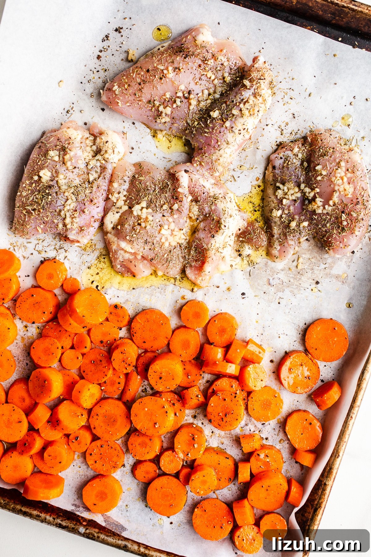 Roasted Carrot and Chicken Quinoa Bowl with Lemon-Tahini Drizzle 5 Chicken and carrots on a sheet pan.