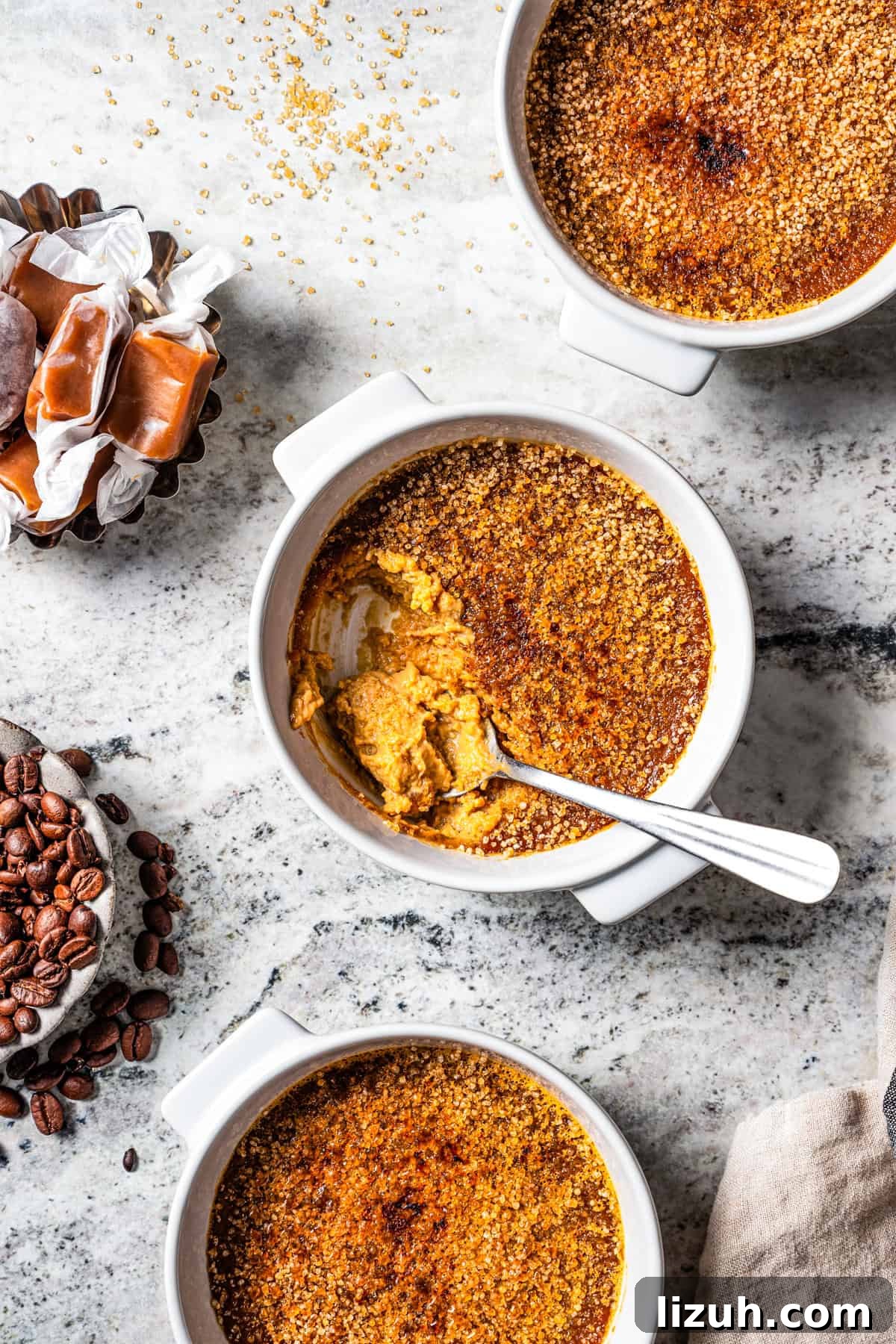 Three ramekins with creme brulee.