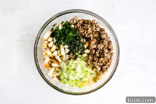 Sausage Stuffing Recipe with Herbs and Crispy Bread 16 Easy Sausage Stuffing ingredients in a glass bowl