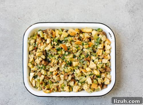 Sausage Stuffing Recipe with Herbs and Crispy Bread 17 overhead view of a baking sheet containing stuffing ingredients