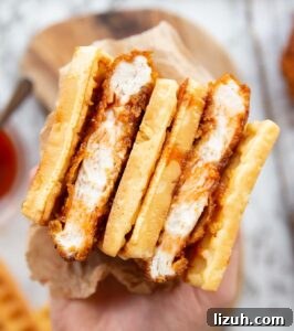 cornflake chicken waffle sandwich overhead close up shot of 2 waffle fried chicken sandwiches showing filling
