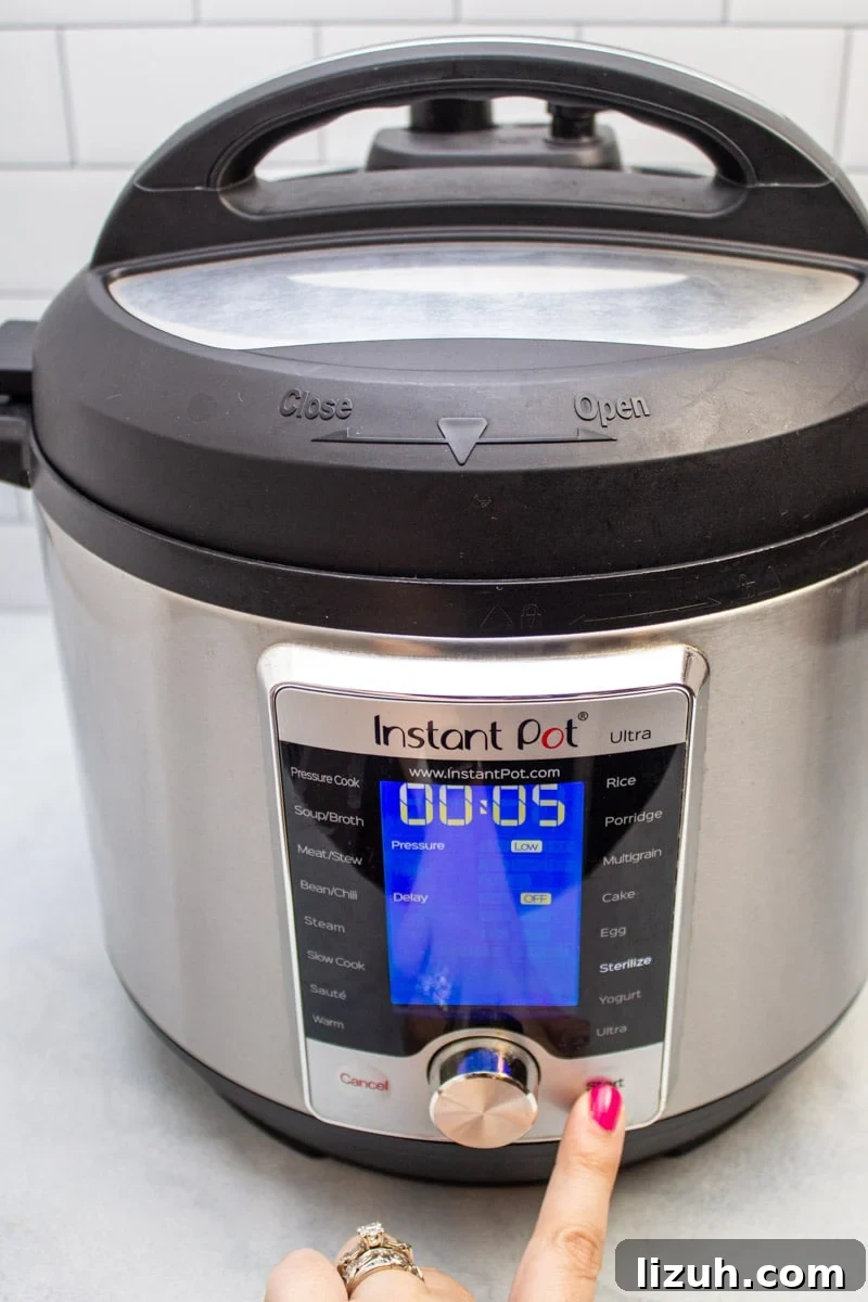 How to Make Creamy Instant Pot Yogurt at Home 7 Pressing start on a sterilization cycle on an Instant Pot.
